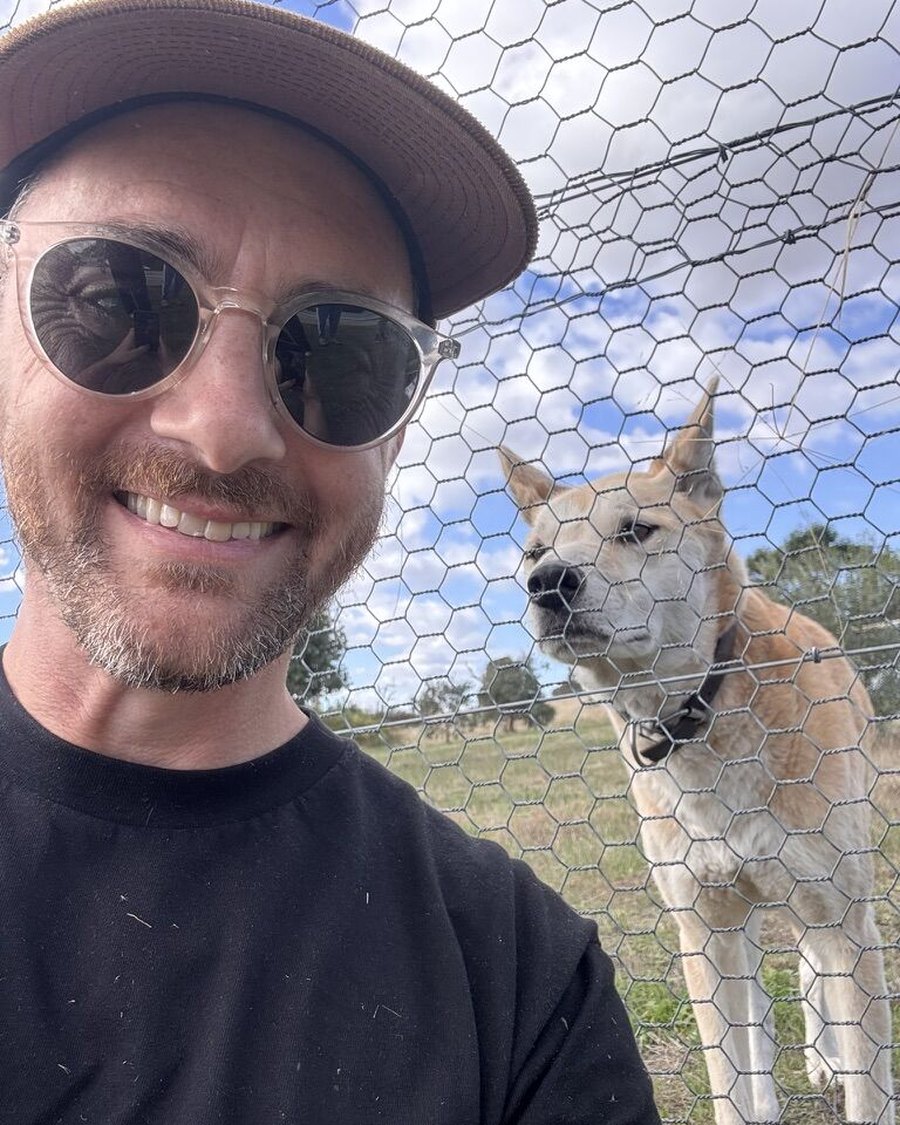 James and a dingo on the farm